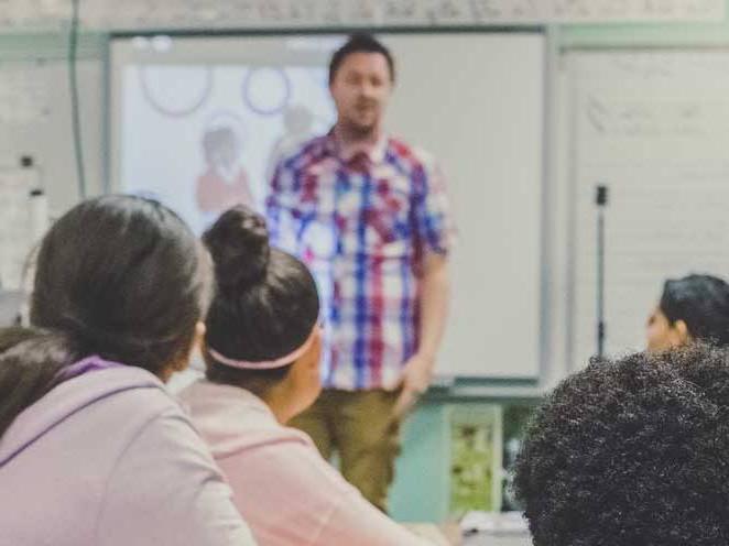 A teacher teaching a group of students